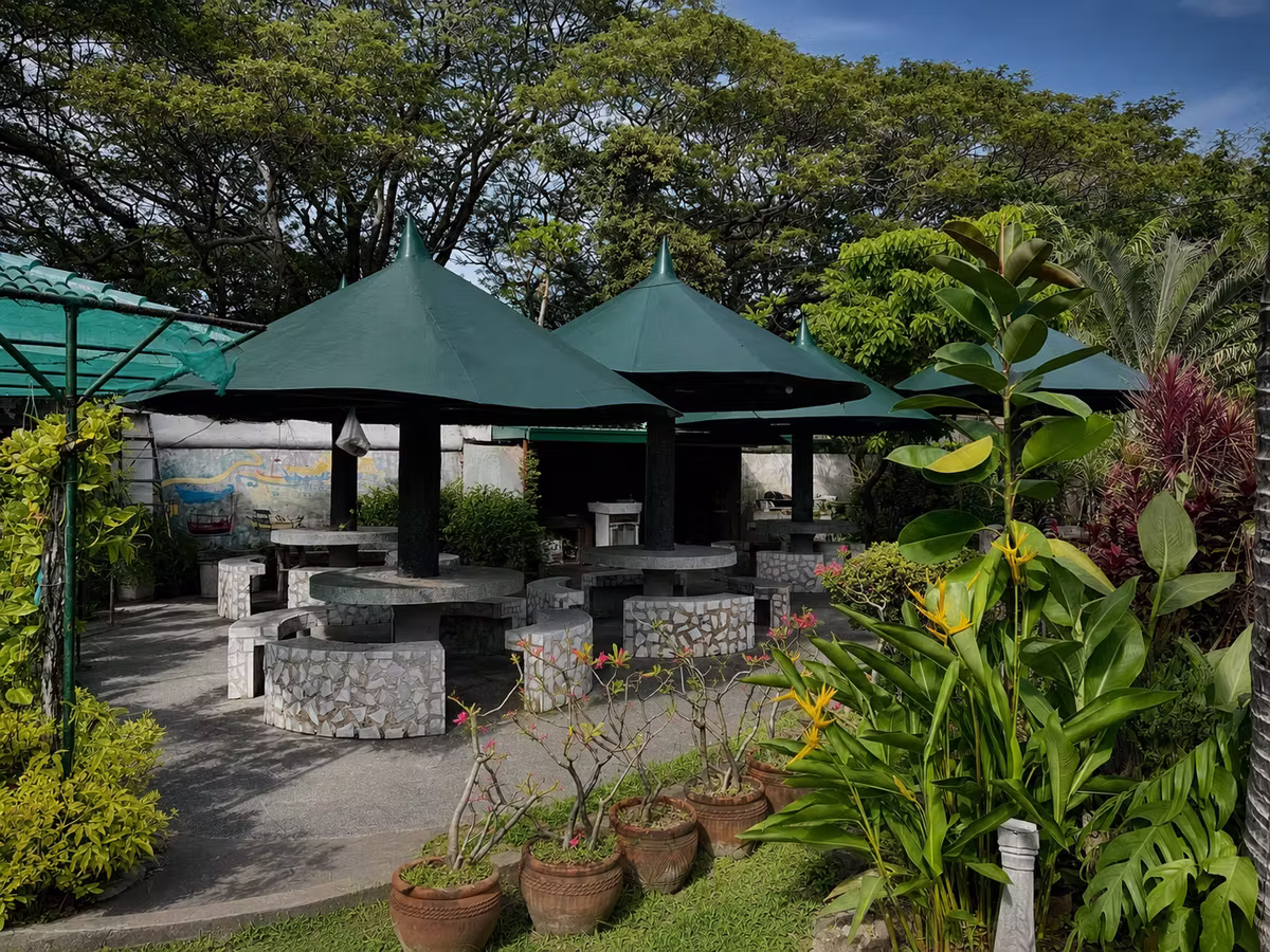 Shaded garden gazebos with stone tables for gathering together
